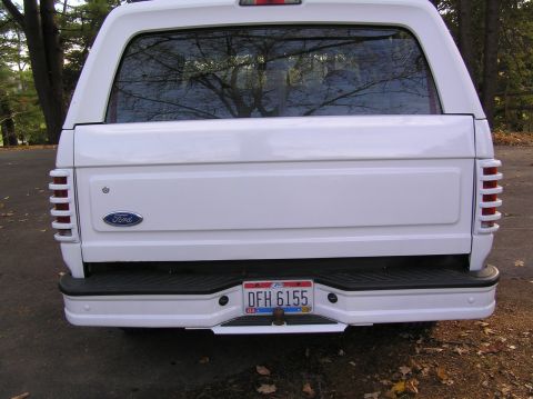 1996 Ford Bronco - removed spare tire hanger, and added slotted tail light covers, painted white.