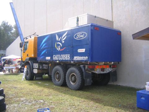 1978 Ford Bronco - This large truck features prominent Gauloises and Ford branding on its blue cargo box.