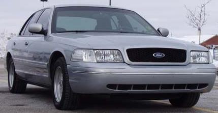 2002 Ford Crown Victoria - Front view of a silver 2002 Ford Crown Victoria sedan.