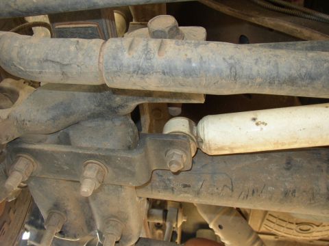 2001 Ford Excursion - Underside view of heavy-duty vehicle suspension parts, including a shock absorber.