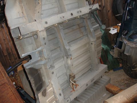 1993 Ford Taurus - The underside of a vehicle is shown, with parts of another vehicle visible in the background.