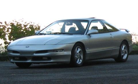 1994 Ford Probe - A silver coupe is shown from a three-quarter front angle.