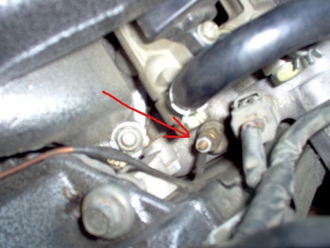 1994 Ford Probe - Engine sensor highlighted with a red arrow, part of a larger engine assembly.
