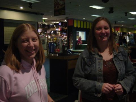 1995 Ford Probe - Two women pose for a photo indoors, with a store or arcade in the background.