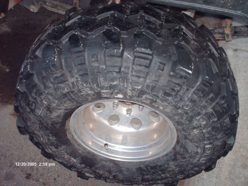Close-up of a large off-road tire on a silver rim