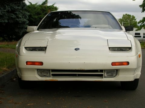 1989 Nissan 300ZX - Front view of a white 1989 Nissan 300ZX with pop-up headlights.