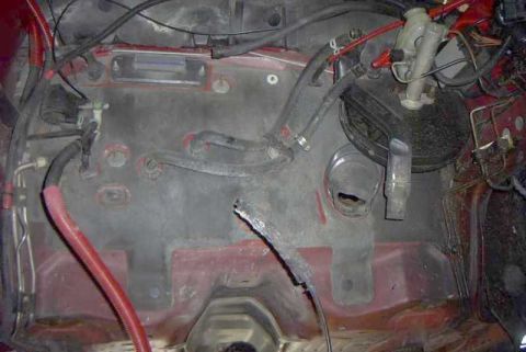 1997 Ford Taurus - This is an empty engine bay, showing the brake booster and master cylinder assembly.