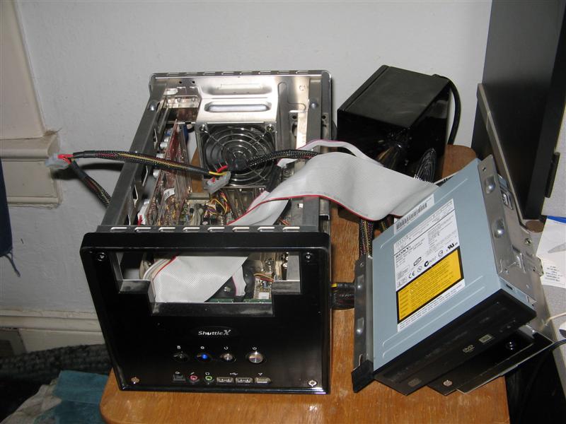 Computer case with internal components exposed, and a separate optical drive unit