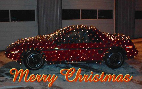 1986 Pontiac Fiero covered in Christmas lights