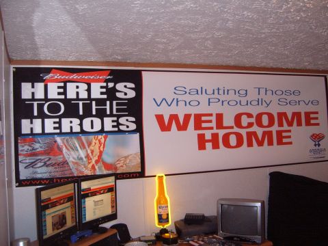 1988 Ford Bronco - Two large banners are displayed on a wall, one promoting Budweiser and the other a welcome home message.