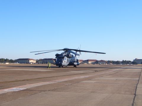 1988 Ford Bronco - A large gray helicopter sits on a concrete airfield under a clear blue sky.