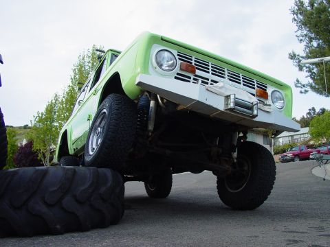 1999 Jeep Grand Cherokee - This 1978 Ford Bronco is modified with a winch and sits on a large tire.