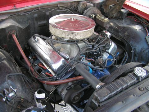 1967 Ford Galaxie - Engine bay detail showing V8 engine components including chrome valve covers and air cleaner.