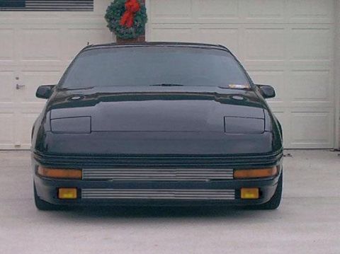 1996 Ford Probe - Front view of a 1996 Ford Probe parked in front of a garage door decorated with a wreath.