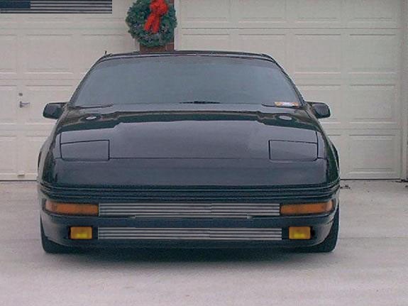 1996 Ford Probe front view, parked in front of a garage door with a wreath