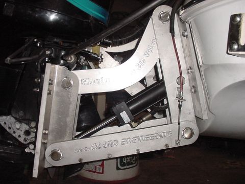 1969 Ford Bronco - Close-up of a boat's outboard motor mount assembly, showing mechanical and hydraulic components.