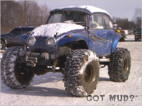 1990 Ford Bronco - This heavily modified VW Beetle is equipped with monster truck tires and covered in snow.