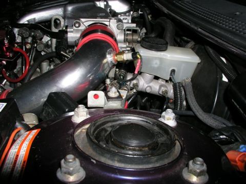 1996 Ford Probe - Close-up view of a modified engine bay, focusing on the intake system and brake components.