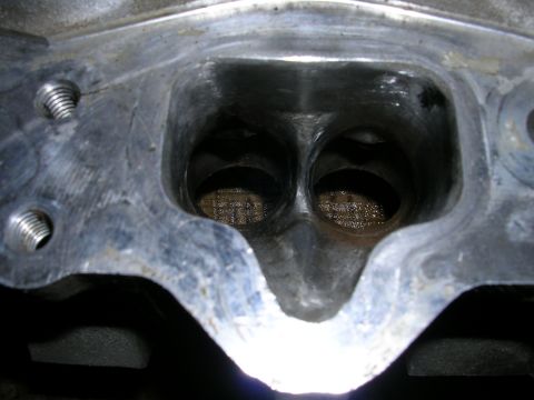 1996 Ford Probe - Engine cylinder head intake ports with visible carbon deposits and wear.