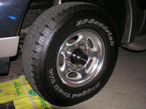 2000 Ford Excursion - Close-up of a vehicle's wheel and tire, showing the BFGoodrich Trail T/A tire and chrome rim.
