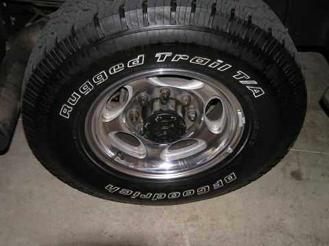 2000 Ford Excursion - Close-up of a BFGoodrich Trail T/A tire mounted on a chrome wheel.