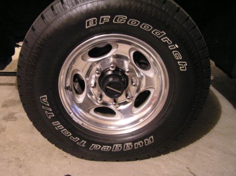 2000 Ford Excursion - Close-up of a BFGoodrich Trail T/A tire and chrome wheel.