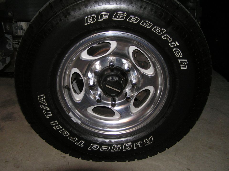 Polished 5-slot aluminum wheel with BFGoodrich Rugged Trail T/A tire