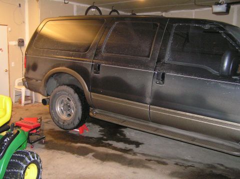 2000 Ford Excursion - I had to jack the rear up to replace the shocks. There just wasn't enough room to maneuver and get leverage on all of the bolts.