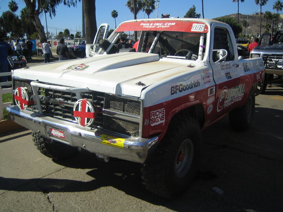 White and red off-road race truck #305 with BFGoodrich and California Tomatoes graphics