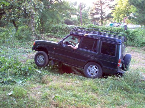 1983 Ford Bronco - He has a LOT more flex than I do, but he still lifted a tire & couldn't make it up & out.