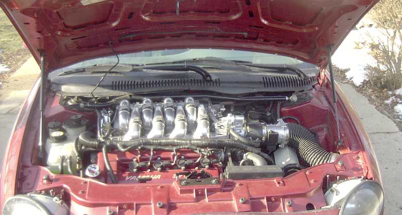 1997 Ford Taurus engine bay with V6 engine and intake