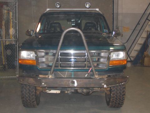 1996 Ford Bronco - Front view of a 1996 Ford Bronco equipped with a custom metal bumper and roll cage.