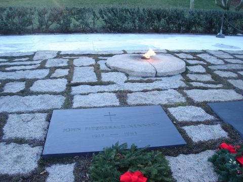 1994 Ford Bronco - The eternal flame burns at John F. Kennedy's grave site, marked by a stone slab.