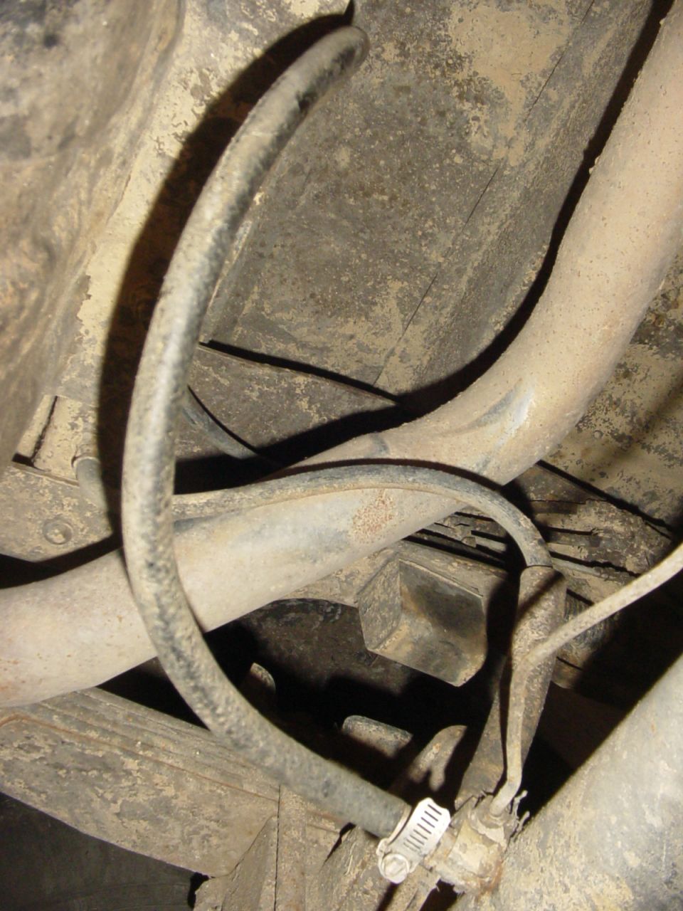 Underbody view of hoses and frame with a SuperMotors.net watermark