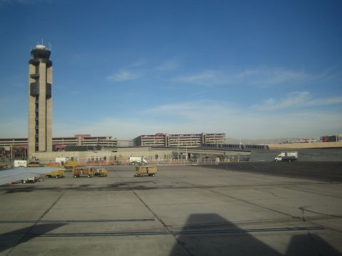 1968 Ford Mustang - An airport scene unfolds with a prominent control tower and various vehicles on the tarmac.