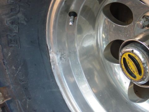 1986 Ford Bronco - Close-up of a wheel a WARN locking hub.