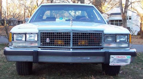 1985 Ford Crown Victoria LTD - Front view of a 1980s Ford sedan, likely a Crown Victoria, showing its distinctive grille and headlights.