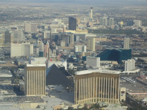 1968 Ford Mustang - An aerial view of the Las Vegas Strip shows numerous hotels and casinos under a hazy sky.