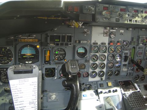 1968 Ford Mustang - Close-up of an airplane's instrument panel, showing numerous gauges and controls.