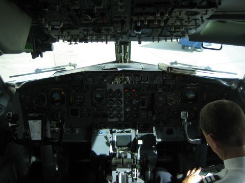1968 Ford Mustang - View from inside an airplane cockpit, showing the pilot and the extensive control panel.