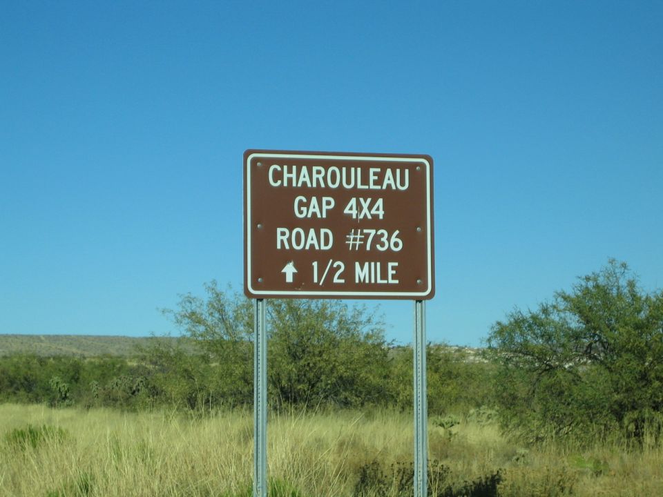 Brown road sign says Charouleau Gap 4x4 Road #736, arrow points up, 1/2 mile