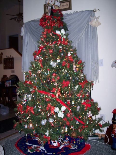 1972 Ford Ranchero - A Christmas tree is decorated with numerous ornaments and bows, set up indoors.