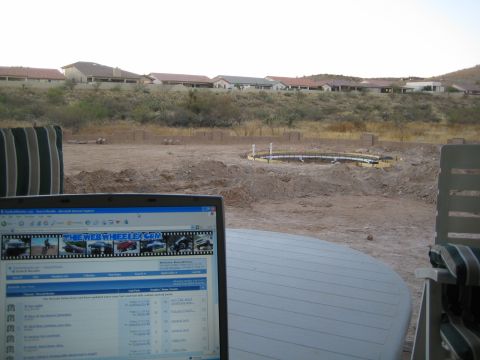 1968 Ford Mustang - Laptop screen shows a car forum with a construction site visible in the background.