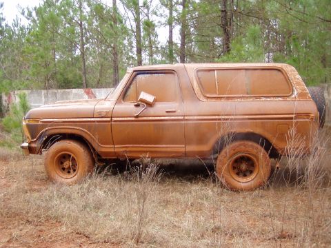 1978 Ford Bronco - This 1978 Ford Bronco is heavily coated in mud, suggesting it has been off-roading.