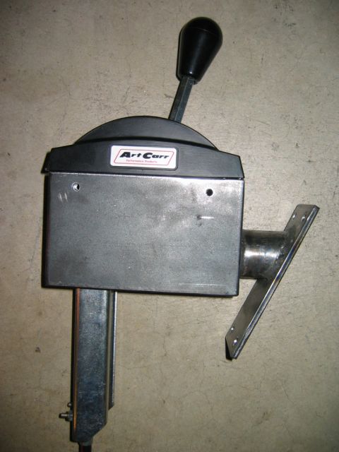 1985 Ford Bronco - This Art Carr shifter assembly features a black knob and a metal mounting bracket. The registry label indicates it is for a 1985 Ford Bronc…