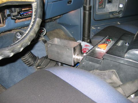 1985 Ford Bronco - The interior of this vehicle shows an aftermarket shifter and gauge, suggesting a model year around 1980.