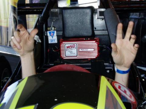 1995 Ford Probe - Hands raised inside a race car cockpit, showing an MSD ignition box.