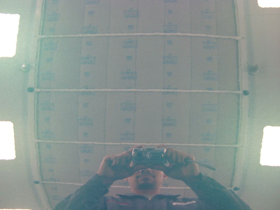 A picture of the hood. The reflection is of the filters on the ceiling.