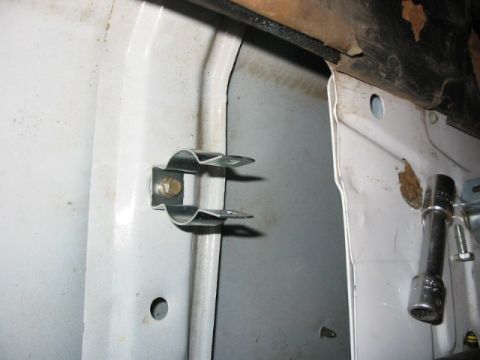 1995 Ford Bronco - hangar bolted down to an existing threaded hole inside the tailgate.