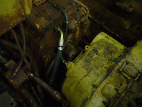 1966 International School Bus - Close-up of engine components with hoses and mechanical parts visible.